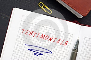 TESTIMONIALS inscription on the page. AÃÂ testimonialÃÂ is a written statement about a person`s character and abilities photo